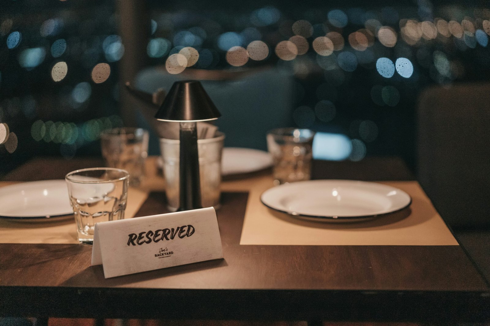 white ceramic plate on brown wooden table