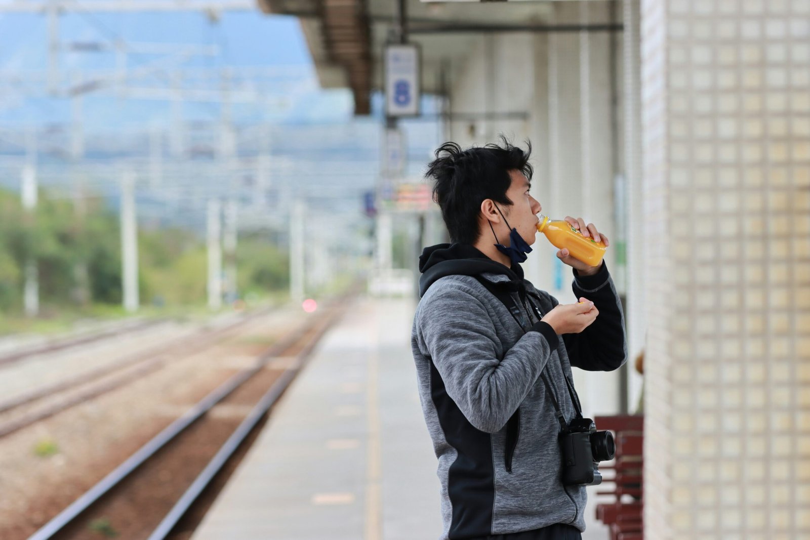 a person drinking from a cup